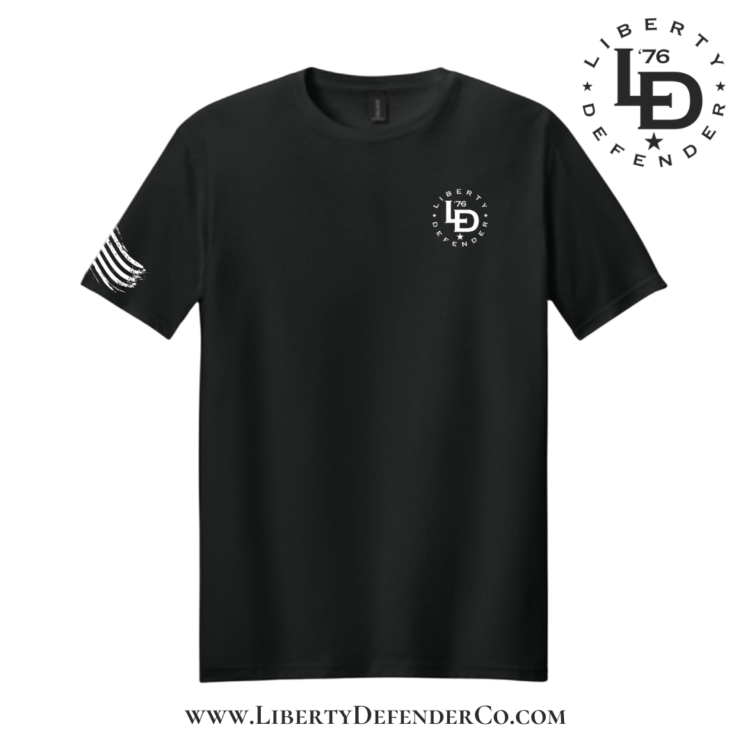 Front view of black t-shirt with small Liberty Defender logo printed on the left chest