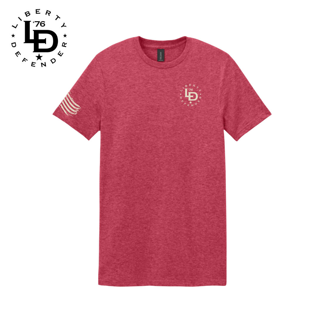 Red heather Liberty Defender men’s graphic tee with LD logo on the chest and American flag print on the sleeve.
